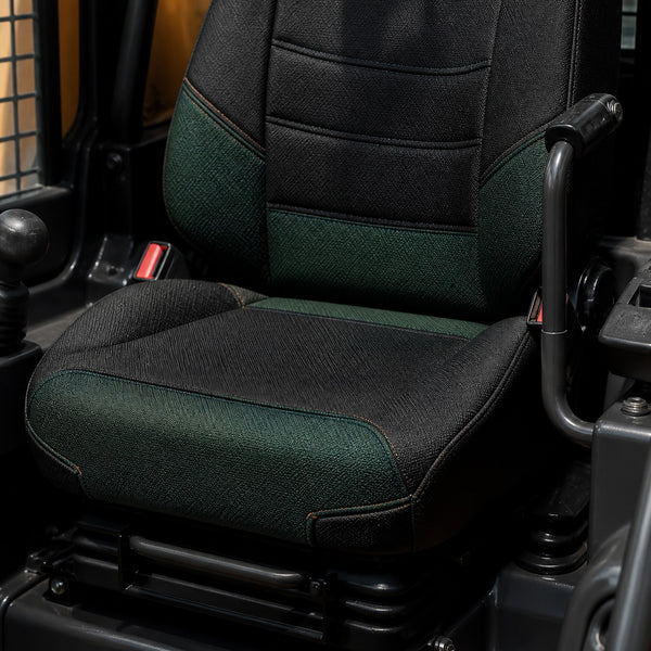 Bear Armor seat cover concept on a representative skid steer seat, construction detail (AI-generated depiction)