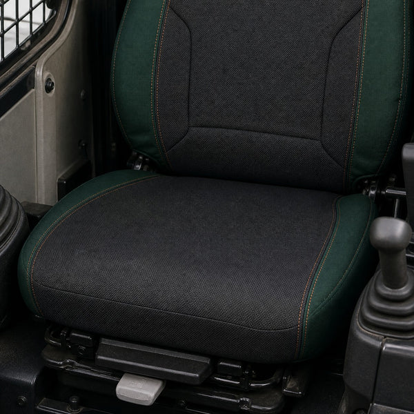 Bear Shield seat cover concept on a representative skid steer seat, construction detail (AI-generated depiction)