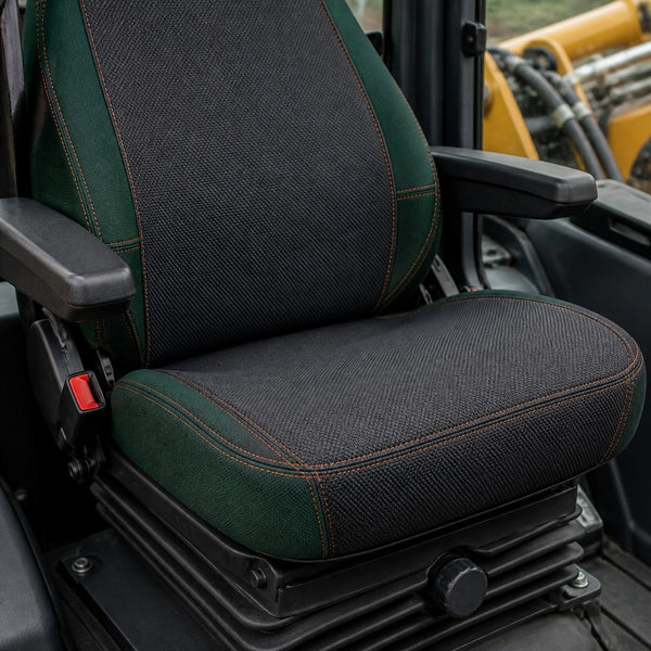 Bear Shield seat cover concept on a representative backhoe seat, construction detail (AI-generated depiction)