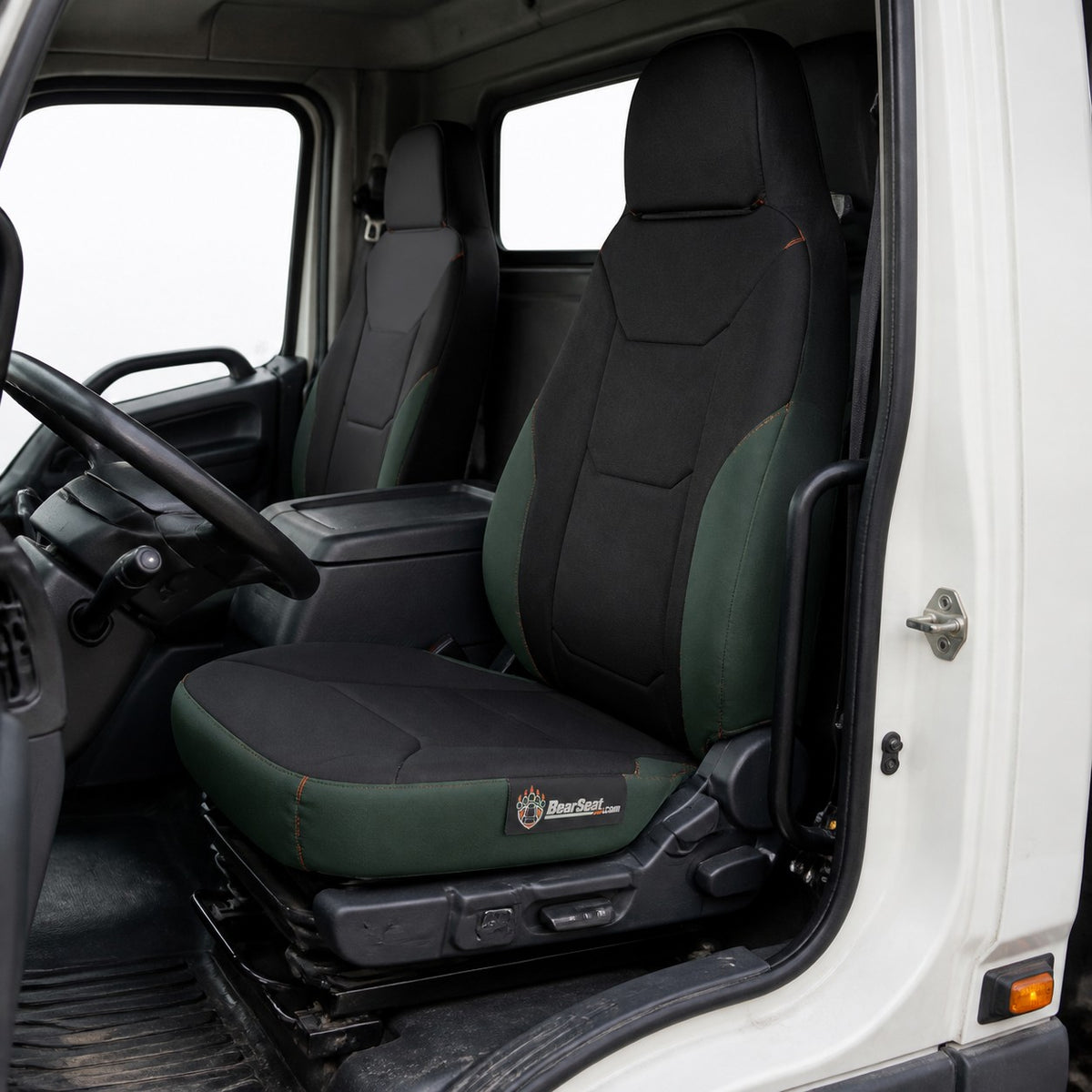 Bear Armor seat cover concept on a representative heavy truck seat, installed in cab (AI-generated depiction)