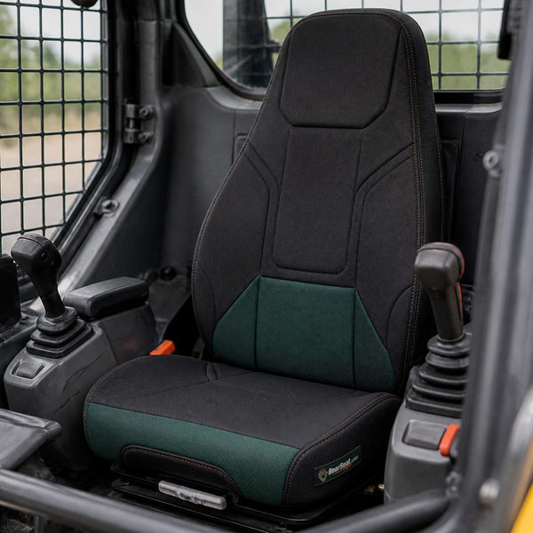 Bear Armor seat cover concept on a representative skid steer seat, installed in cab (AI-generated depiction)